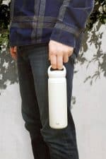 Iku Active white thermal vacuum flask being carried