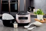 Yum Asia Bamboo UMAI IH Rice Cooker (champagne rose) on table with accessories